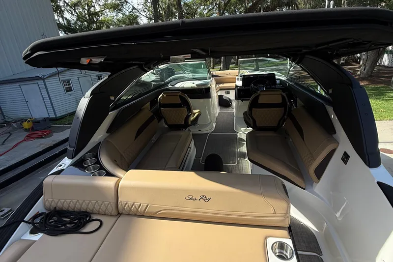 Slide: The Image of 2023 Sea Ray SLX 260 Outboard interior with luxurious seating and modern design. - 21