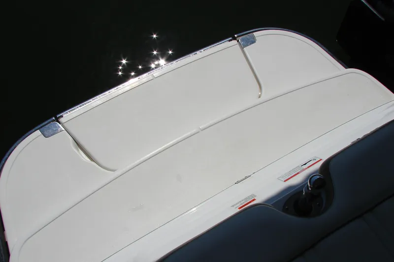 Slide: The Image of 2011 Cobalt 232 boat swim platform with sunlight reflections on water. - 10