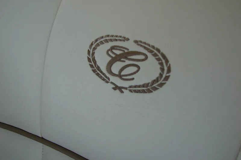 Slide: The Image of Embroidered logo on white leather seat of 2011 Cobalt 232 boat. - 21