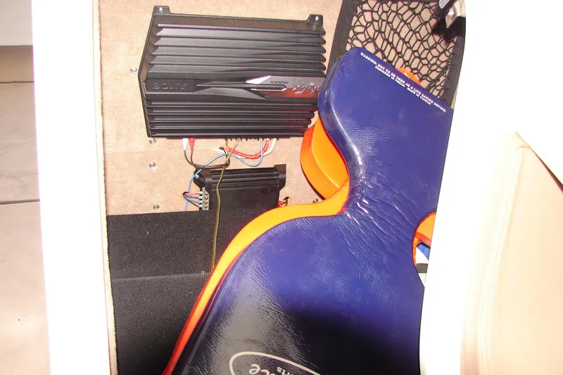 Slide: The Image of 2011 Cobalt 232 interior with Sony amplifier and life jacket storage. - 22