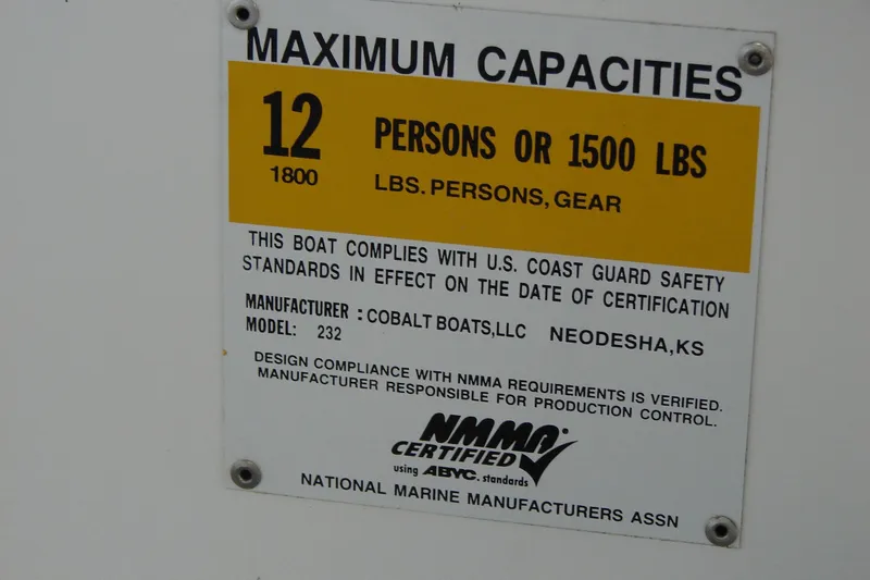 Slide: The Image of Capacity label for 2011 Cobalt 232 boat, maximum 12 persons or 1500 lbs. - 29