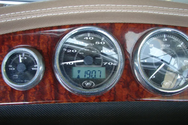 Slide: The Image of Dashboard of 2011 Cobalt 232 boat with speedometer, voltmeter, and RPM gauges. - 32