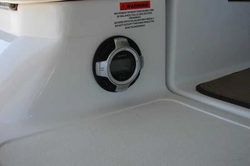 Slide: The Image of Sony audio control panel on 2011 Cobalt 232 boat with warning label. - 33