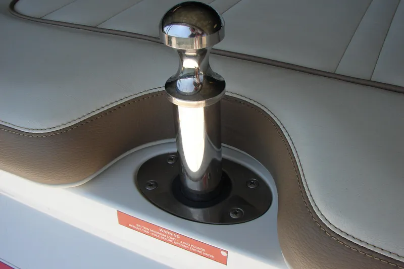Slide: The Image of 2011 Cobalt 232 boat interior with stainless steel ski tow pylon and cushioned seating. - 34