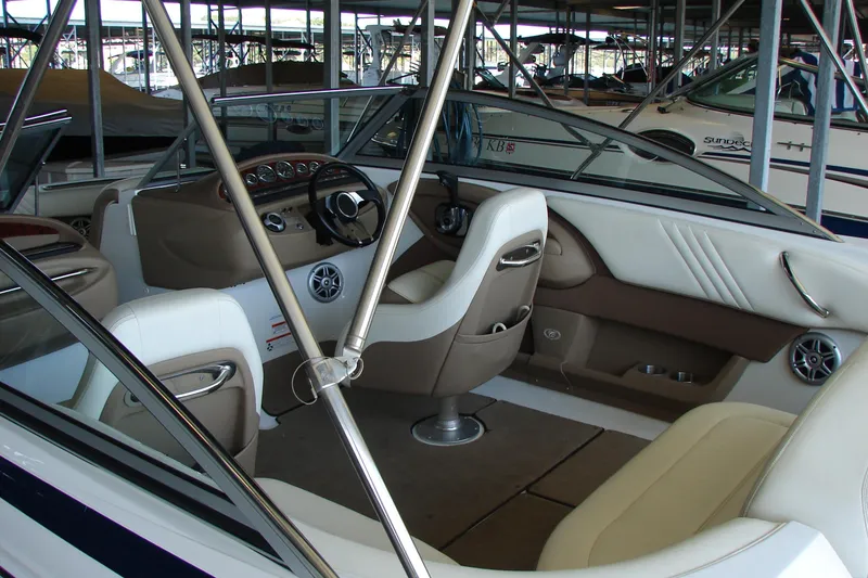 Slide: The Image of Interior of a 2011 Cobalt 232 boat, featuring sleek seating and modern dashboard design. - 43