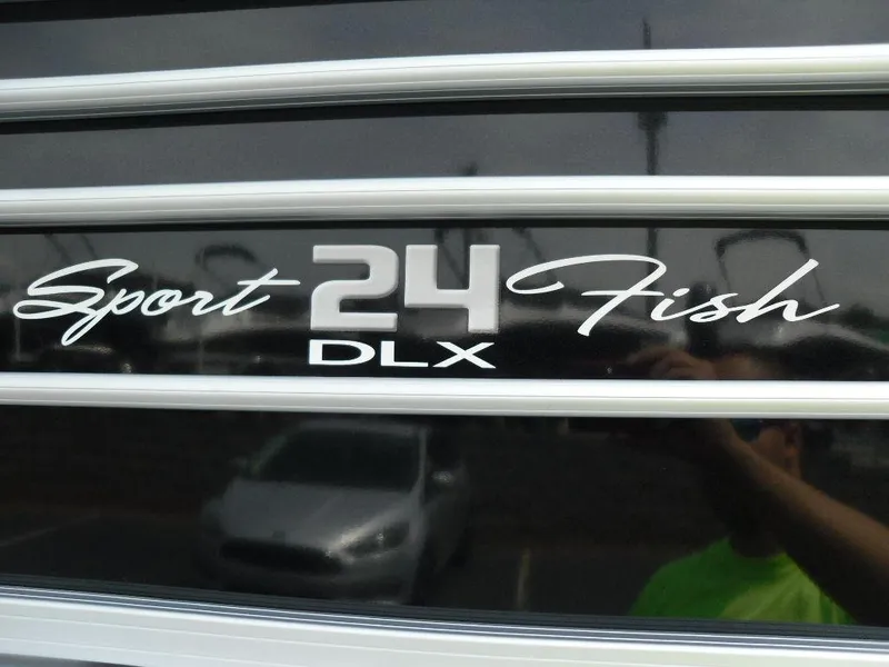 Slide: The Image of 2023 Sun Tracker Sportfish™ 24 XP3 logo on boat exterior. - 11