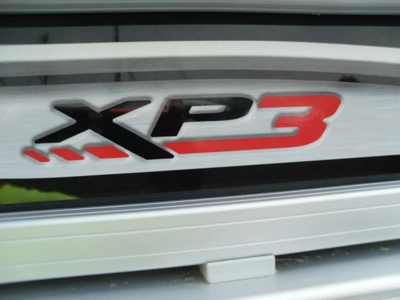 Slide: The Image of 2023 Sun Tracker Sportfish™ 24 XP3 logo in bold black and red lettering. - 13