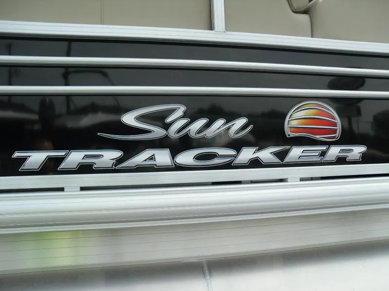 Slide: The Image of 2023 Sun Tracker Sportfish™ 24 XP3 logo on boat exterior. - 16
