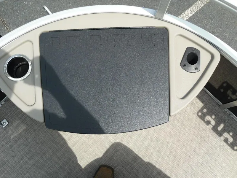 Slide: The Image of 2023 Sun Tracker Sportfish™ 24 XP3 boat deck with cup holder and storage compartment. - 17