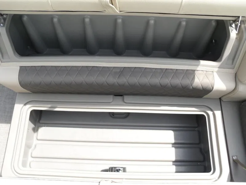 Slide: The Image of 2023 Sun Tracker Sportfish™ 24 XP3 storage compartments, open and empty, showcasing spacious interior design. - 29