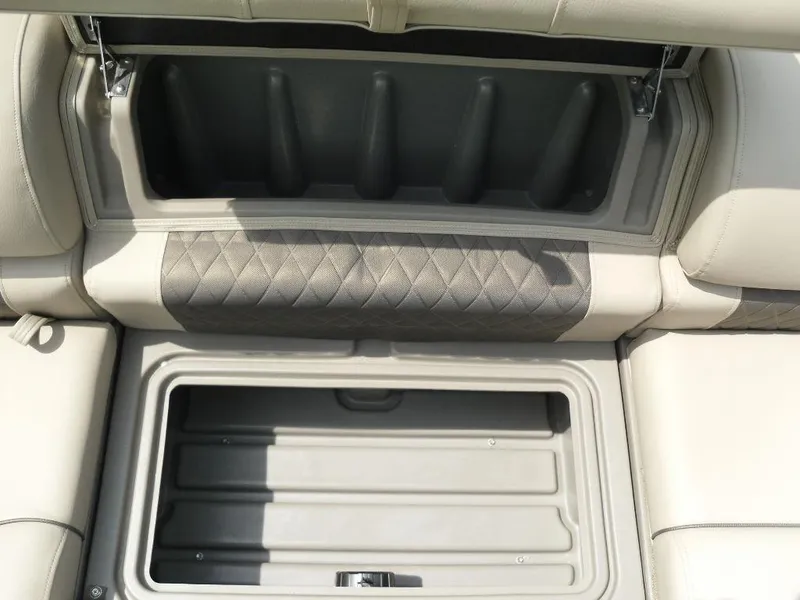 Slide: The Image of 2023 Sun Tracker Sportfish™ 24 XP3 storage compartments with cushioned seating. - 30
