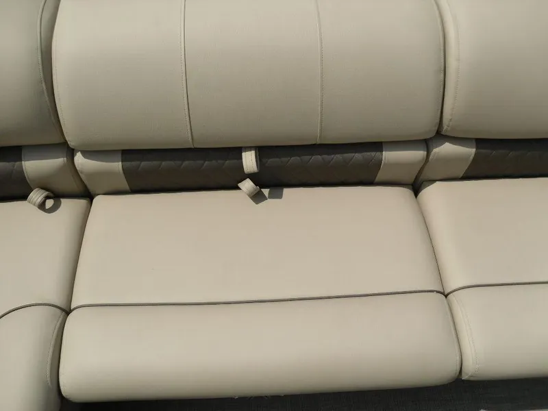 Slide: The Image of 2023 Sun Tracker Sportfish™ 24 XP3 beige boat seating, featuring cushioned upholstery. - 31