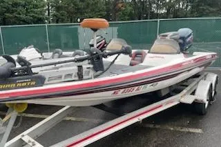 Slide: The Image of 2000 Javelin 20 Renegade boat on trailer, parked outdoors. - 10