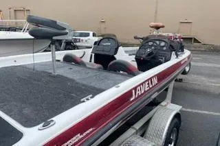 Slide: The Image of 2000 Javelin 20 Renegade boat in parking lot, side view. - 13