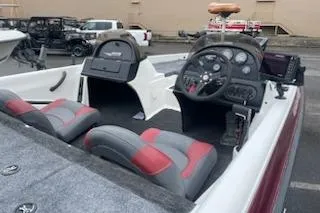 Slide: The Image of 2000 Javelin 20 Renegade boat interior with dual seats and control panel. - 19