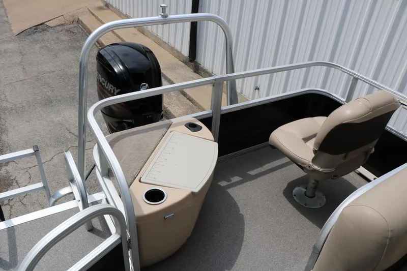 Slide: The Image of 2017 Sun Tracker Fishing Barge 20 DLX with Mercury outboard motor and seating area. - 17