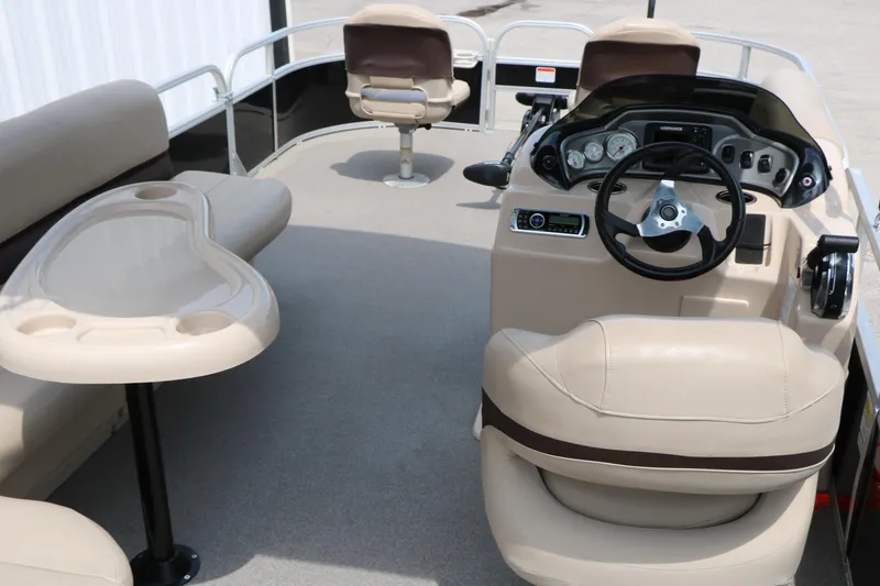 Slide: The Image of 2017 Sun Tracker Fishing Barge 20 DLX interior with steering console and seating. - 19