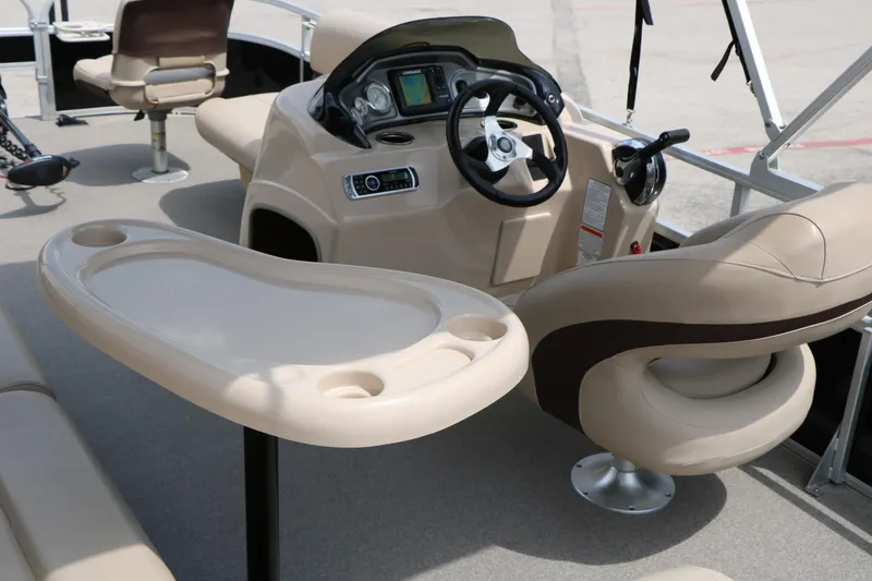 Slide: The Image of 2017 Sun Tracker Fishing Barge 20 DLX interior with steering console and seating. - 22