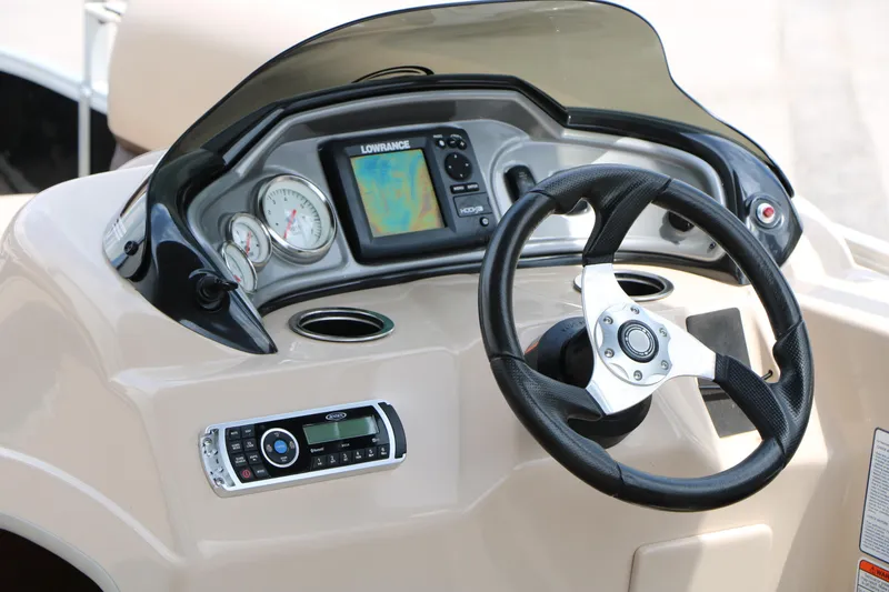 Slide: The Image of 2017 Sun Tracker Fishing Barge 20 DLX dashboard with steering wheel and navigation system. - 23