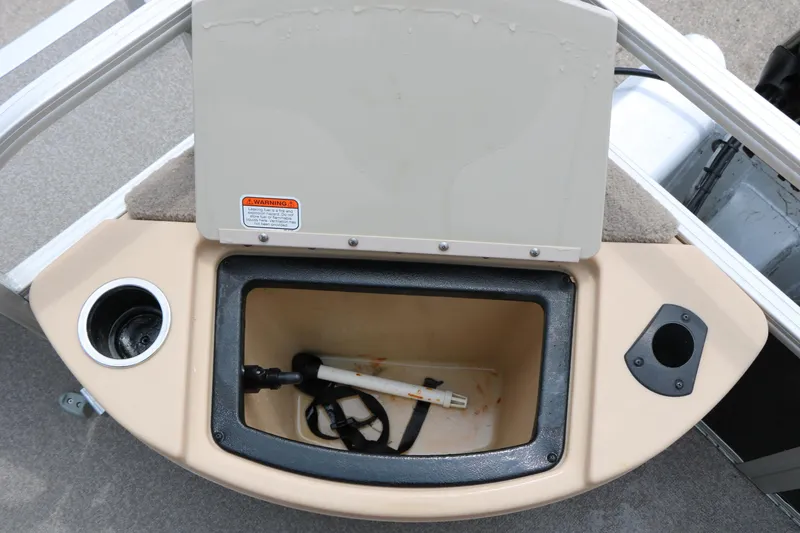 Slide: The Image of 2017 Sun Tracker Fishing Barge 20 DLX storage compartment with cup holders and accessories. - 25