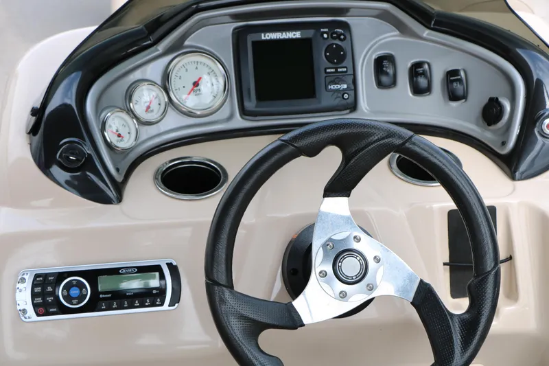 Slide: The Image of 2017 Sun Tracker Fishing Barge 20 DLX dashboard with steering wheel and control panel. - 26