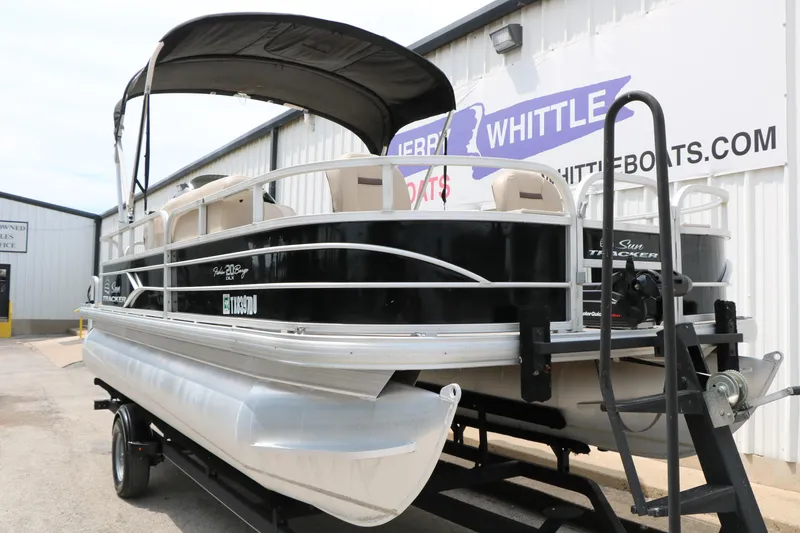 Slide: The Image of 2017 Sun Tracker Fishing Barge 20 DLX pontoon boat on trailer outside dealership. - 5