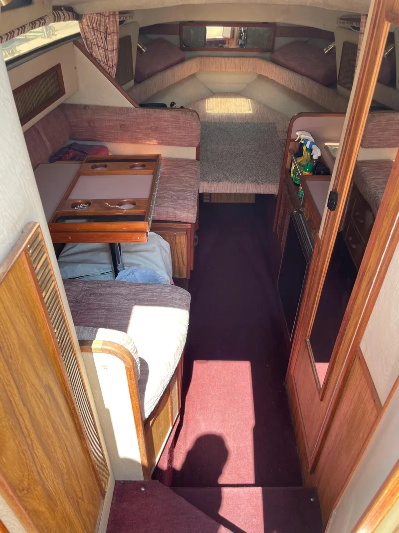 Slide: The Image of Interior of a 1986 Sea Ray 268 Weekender boat with seating and table. - 18