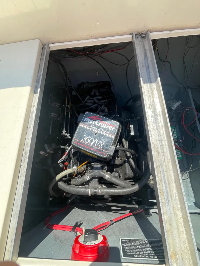 Slide: The Image of 1986 Sea Ray 268 Weekender engine compartment with MerCruiser engine visible. - 30
