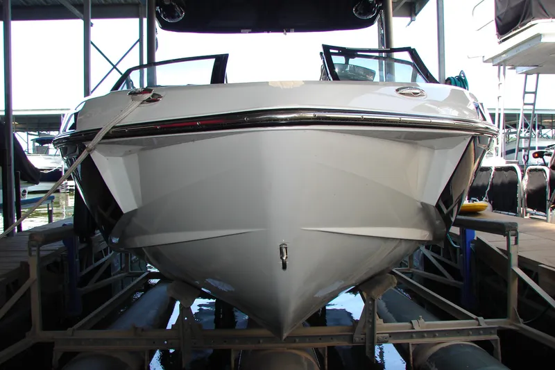 Slide: The Image of 2021 Malibu Wakesetter 22 LSV boat docked in marina, front view. - 25