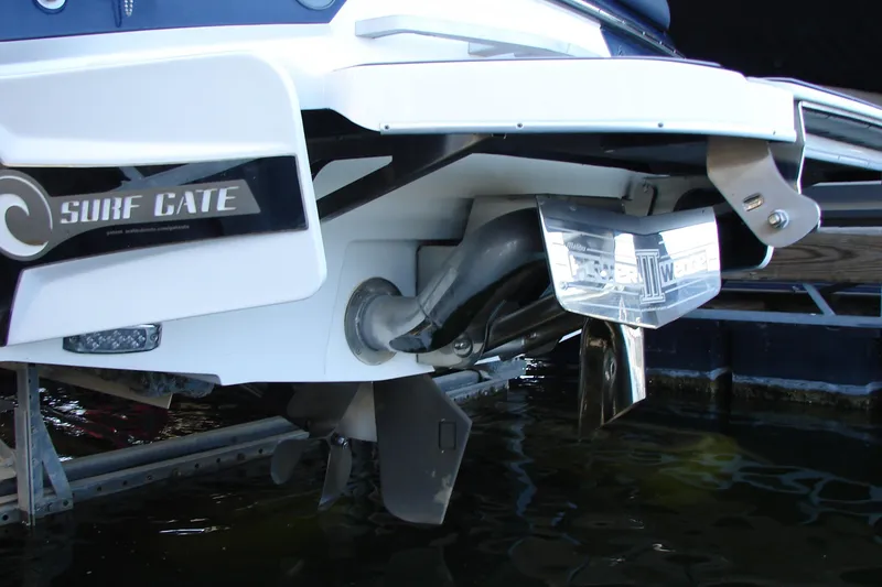 Slide: The Image of 2021 Malibu Wakesetter 22 LSV boat with Surf Gate technology in water. - 26