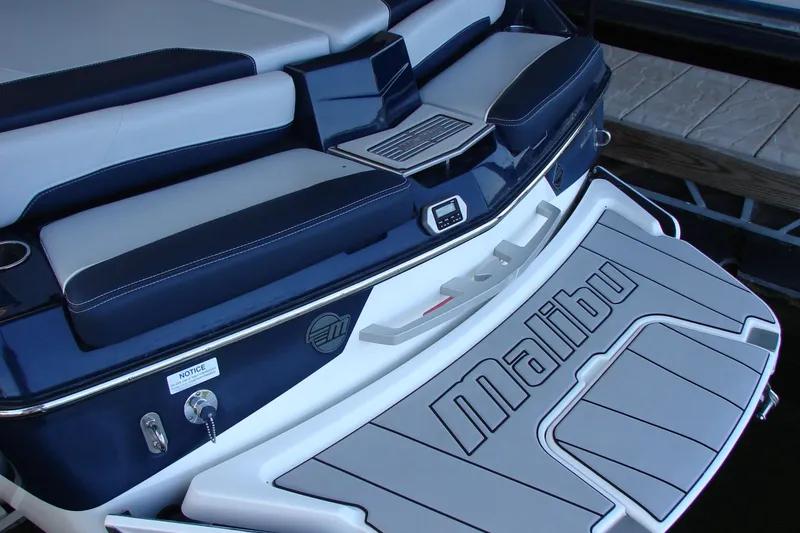 Slide: The Image of 2021 Malibu Wakesetter 22 LSV boat rear view with branded swim platform. - 28