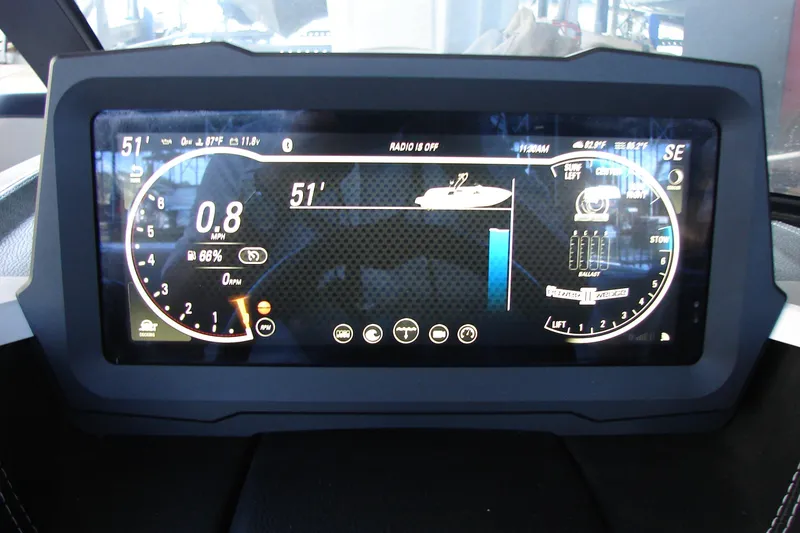 Slide: The Image of Dashboard display of a 2021 Malibu Wakesetter 22 LSV boat, showing speed and controls. - 36