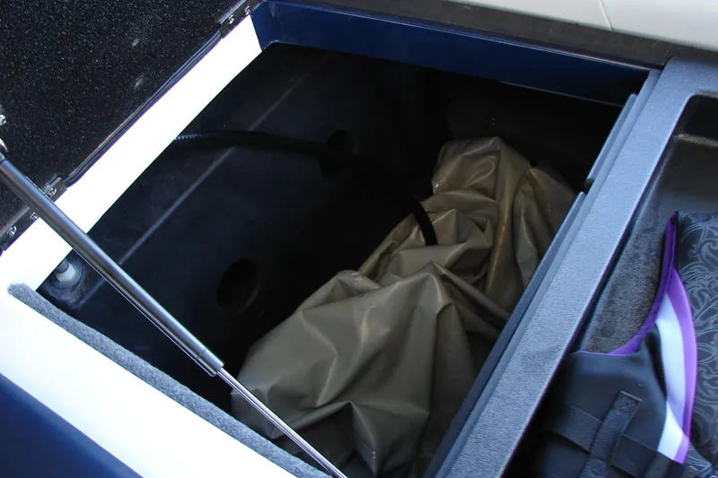 Slide: The Image of Storage compartment of 2021 Malibu Wakesetter 22 LSV boat, featuring interior details. - 38