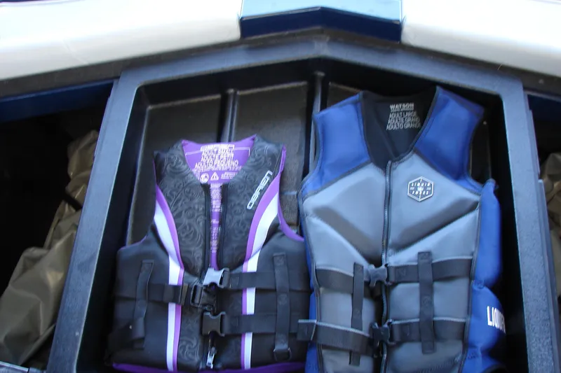 Slide: The Image of Life jackets stored in a 2021 Malibu Wakesetter 22 LSV boat compartment. - 40