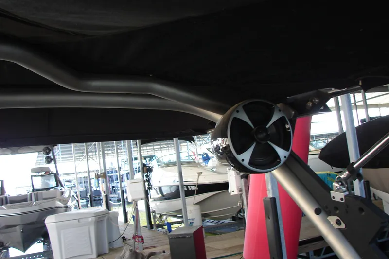 Slide: The Image of 2021 Malibu Wakesetter 22 LSV boat with speaker system in marina setting. - 41