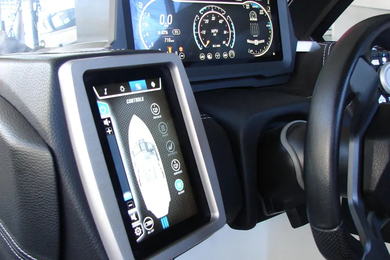Slide: The Image of 2021 Malibu Wakesetter 22 LSV dashboard with digital controls and touchscreen display. - 47