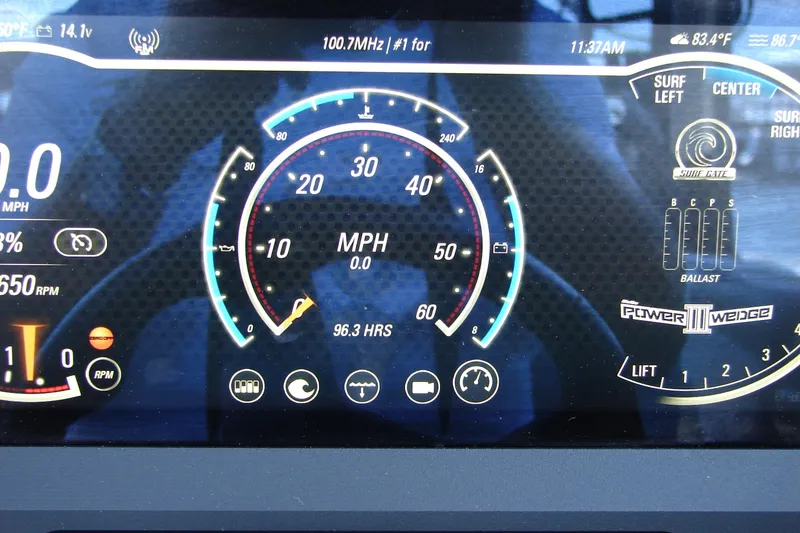 Slide: The Image of Dashboard of 2021 Malibu Wakesetter 22 LSV showing speed, RPM, and surf settings. - 49