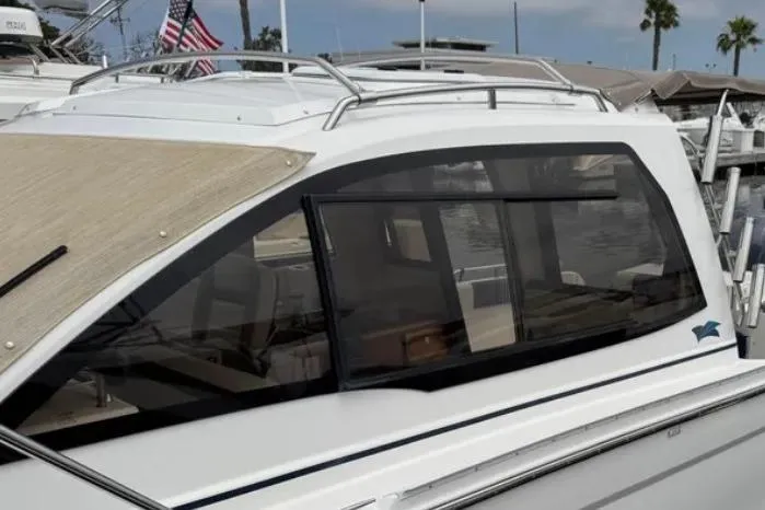 Slide: The Image of 2019 Cutwater C-24 Coupe boat with sleek design, docked in a marina. - 11