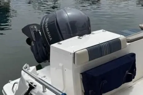 Slide: The Image of 2019 Cutwater C-24 Coupe with Yamaha outboard motor, docked on calm water. - 14