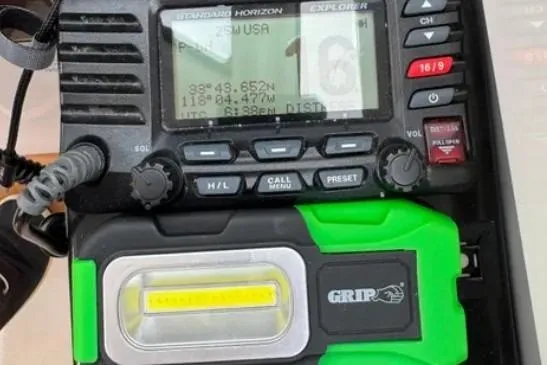 Slide: The Image of Standard Horizon radio and GRIP flashlight on 2019 Cutwater C-24 Coupe boat. - 24