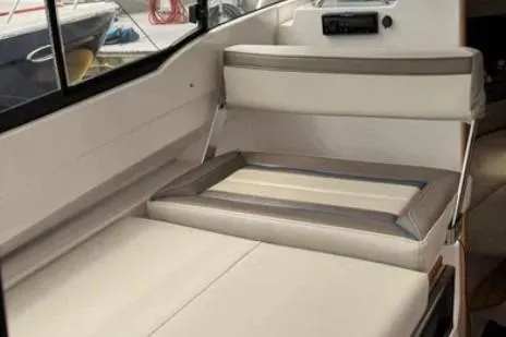 Slide: The Image of 2019 Cutwater C-24 Coupe interior seating with modern design and neutral tones. - 29