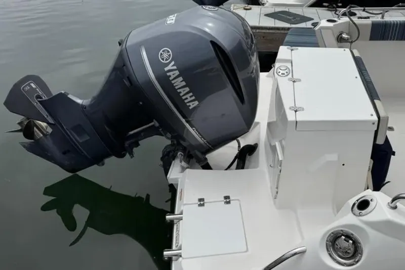 Slide: The Image of 2019 Cutwater C-24 Coupe with Yamaha outboard motor, docked on calm water. - 38