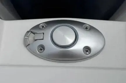 Slide: The Image of 2019 Cutwater C-24 Coupe boat detail, featuring a sleek metallic button fixture. - 42