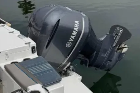 Slide: The Image of 2019 Cutwater C-24 Coupe with Yamaha outboard motor on calm water. - 45