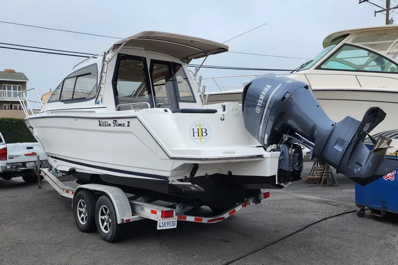 Slide: The Image of 2019 Cutwater C-24 Coupe boat on trailer with Yamaha outboard motor. - 51