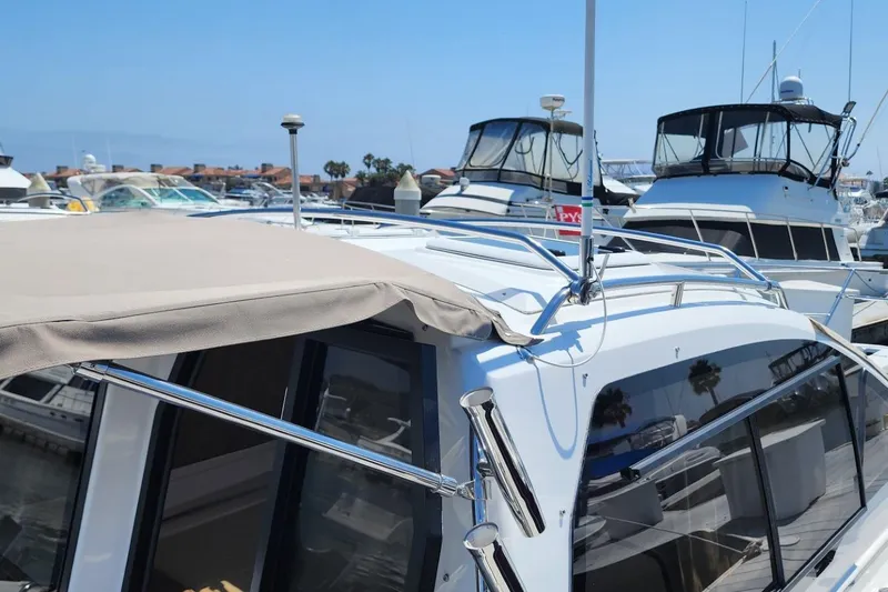 Slide: The Image of 2019 Cutwater C-24 Coupe docked among other boats in a marina. - 9