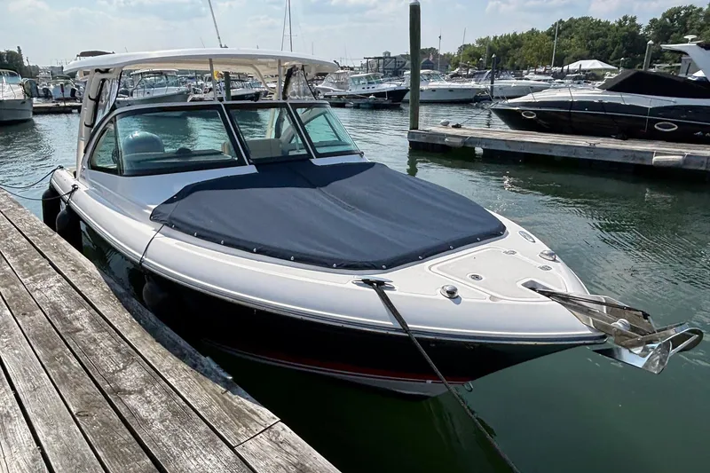 Slide: The Image of 2017 Pursuit DC 235 Dual Console boat docked in a marina. - 4