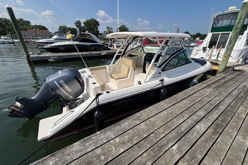 Slide: The Image of 2017 Pursuit DC 235 Dual Console boat docked with Yamaha outboard motor. - 7