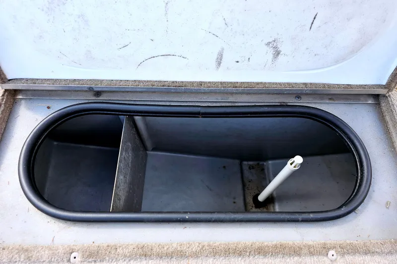 Slide: The Image of Open storage compartment in 2000 Alumacraft Navigator 165 CS boat. - 18