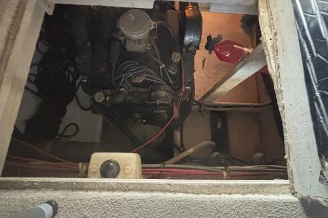 Slide: The Image of Engine compartment of a 1990 Bayliner 3888 boat, showing mechanical components and wiring. - 20